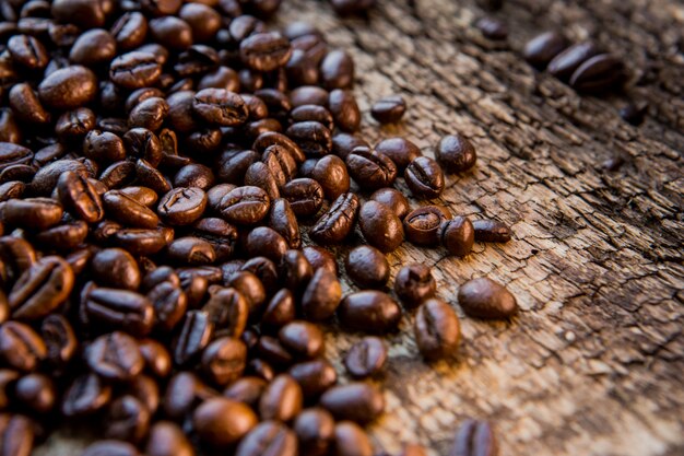 Coffee beans on wood texture