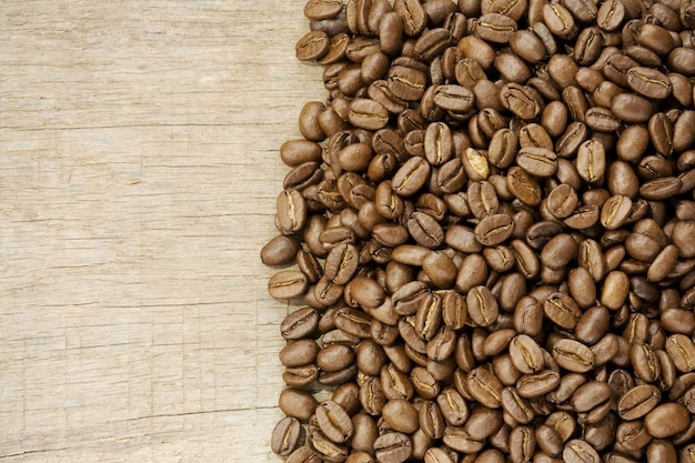 Coffee beans on wood texture