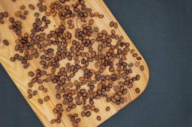 Coffee beans on wooden background. Coffee Concept. Coffee beans.