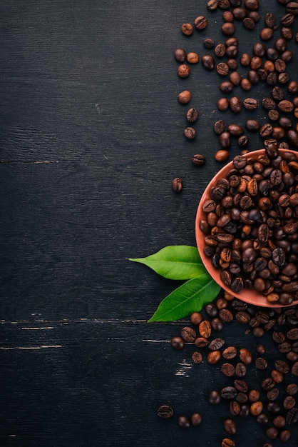 Coffee beans On a wooden background Top view Copy space