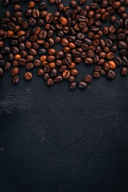 Coffee beans On a wooden background Top view Copy space