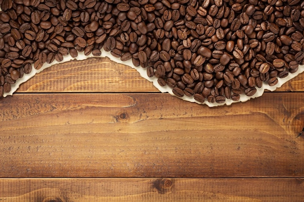 Coffee beans on wooden background