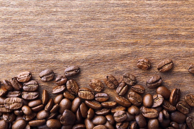 Coffee beans on wooden background