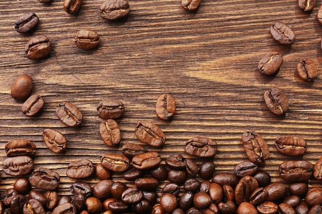 Coffee beans on wooden background