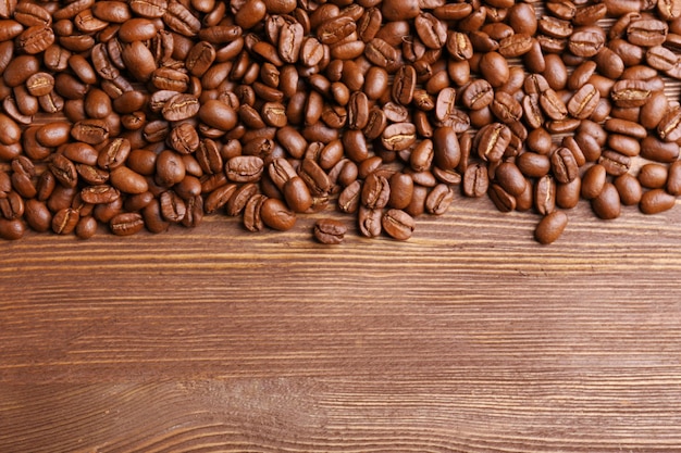 Coffee beans on wooden background