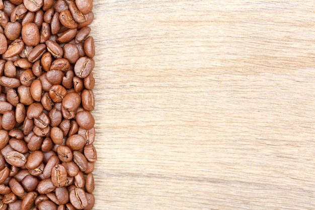 Coffee beans on wooden background