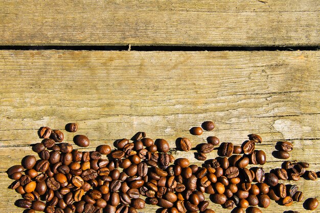 Coffee beans on wooden background