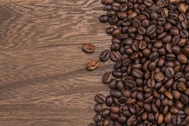 Coffee beans on wooden background