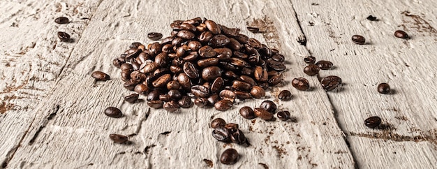 Coffee beans on wooden background