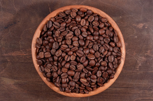 Coffee beans in a wooden bowl