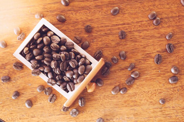 Coffee beans in wooden drawer close up