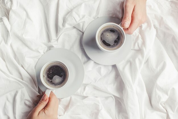 Coffee in bed. Selective focus. Love drink.