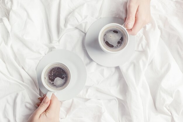 Coffee in bed. Selective focus. Love drink.