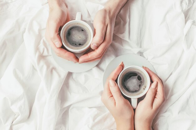 Coffee in bed. Selective focus. Love drink.