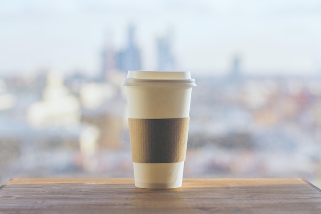 Coffee on blurry city