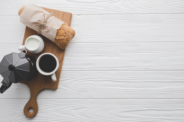 Coffee and bread on board