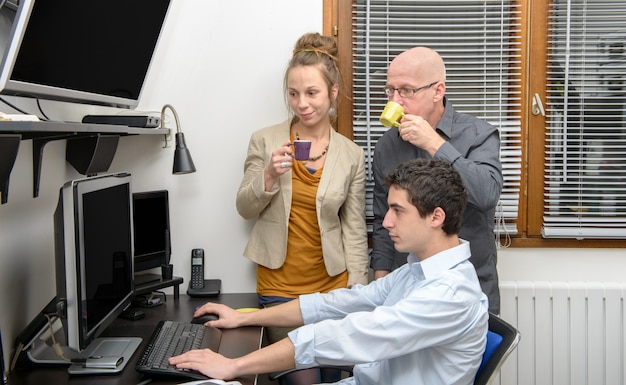 Coffee break in the office with colleagues