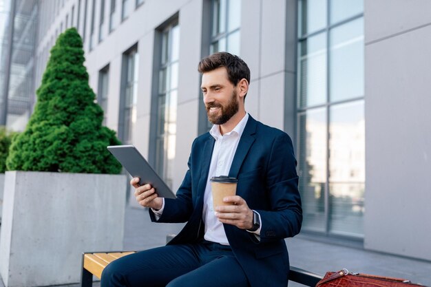 Coffee break successful business Glad confident attractive young caucasian guy with beard in suit