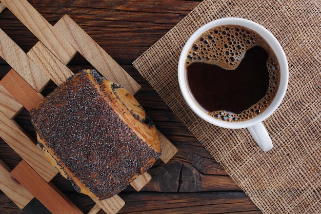 Coffee and bun with poppy seeds