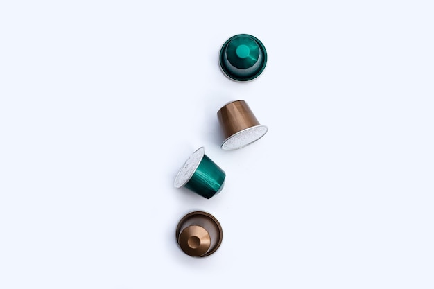 Coffee capsules on white background