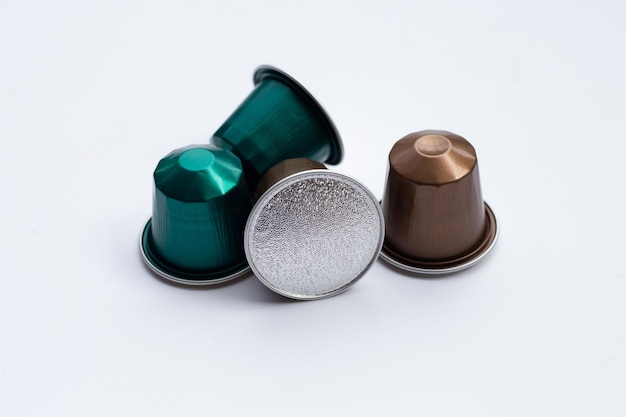 Coffee capsules on white background