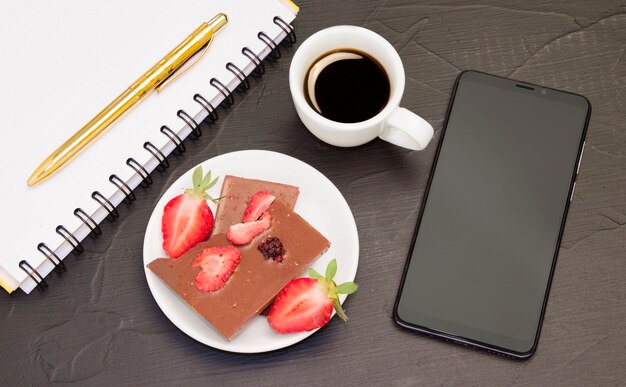 Coffee and chocolate with strawberries