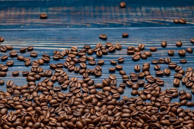 Coffee close up on a wooden blue table.