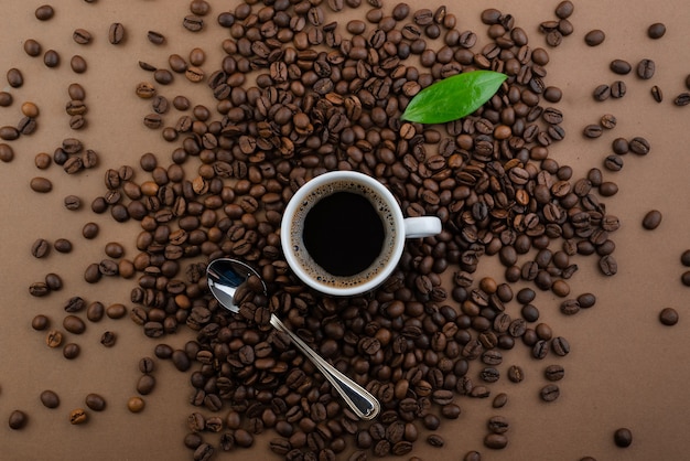 Coffee and coffee beans on a brown table