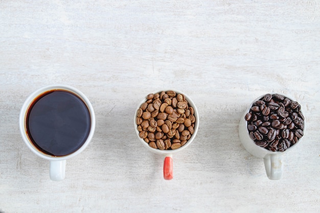  Coffee and coffee beans in cup on table