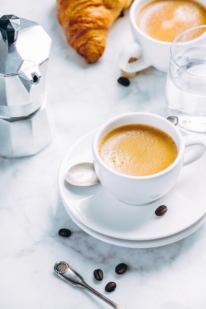 Photo coffee composition on white marble background coffee espresso in white cups