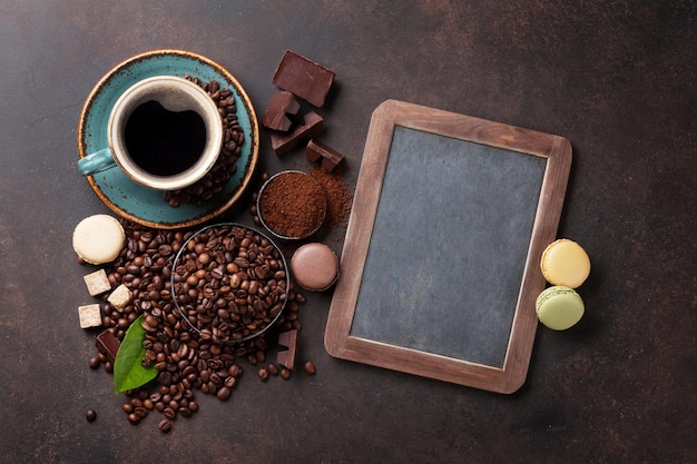 Coffee cup beans and macaroons