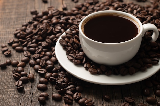 Coffee cup and beans on a rustic background. Espresso.