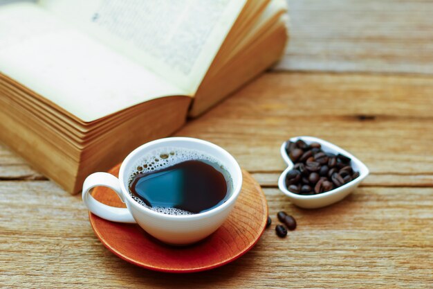 Coffee cup & book on wood table 