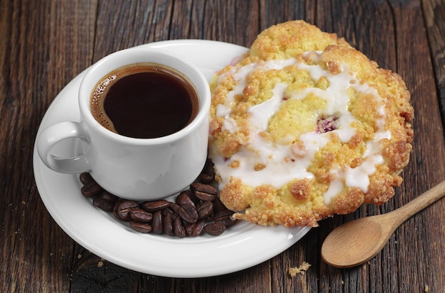 Coffee cup and bun with cherry