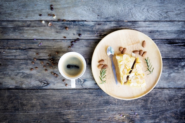 Coffee cup and cake on table.