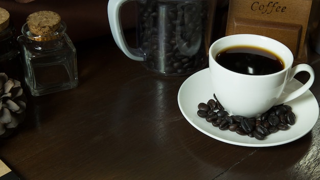 Coffee cup and coffee beans on wooden vintage