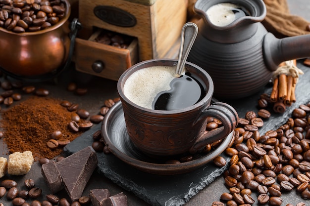 Photo coffee in a cup on coffee beans.