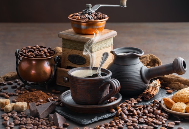 Coffee in a cup on coffee beans.