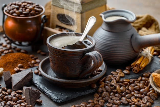 Coffee in a cup on coffee beans.