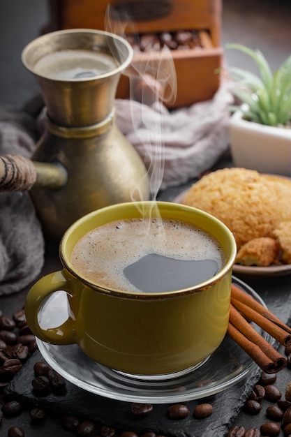 Coffee in a cup on coffee beans