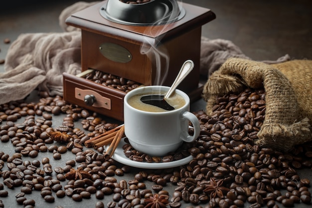 Coffee in a cup on coffee beans