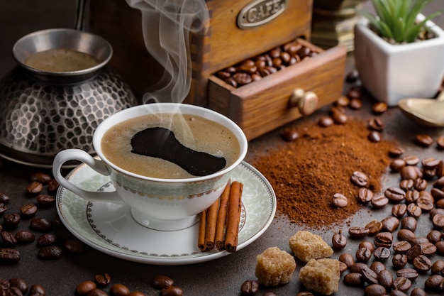 Coffee in a cup on coffee beans