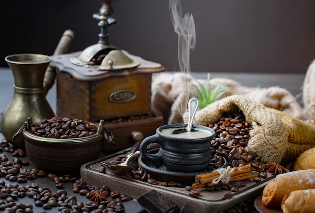 Coffee in a cup on coffee beans