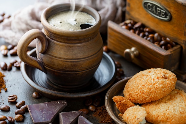 Coffee in a cup on coffee beans