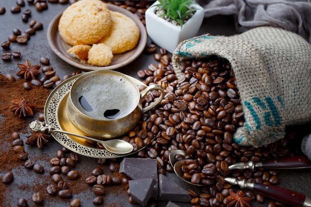 Coffee in a cup on coffee beans