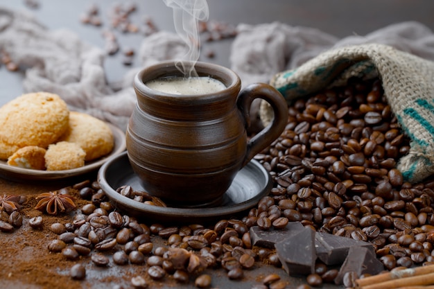 Coffee in a cup on coffee beans