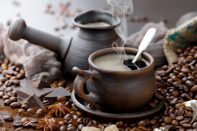 Coffee in a cup on coffee beans