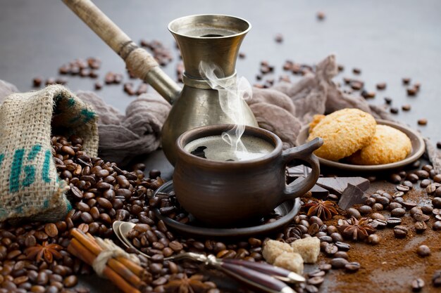 Coffee in a cup on coffee beans