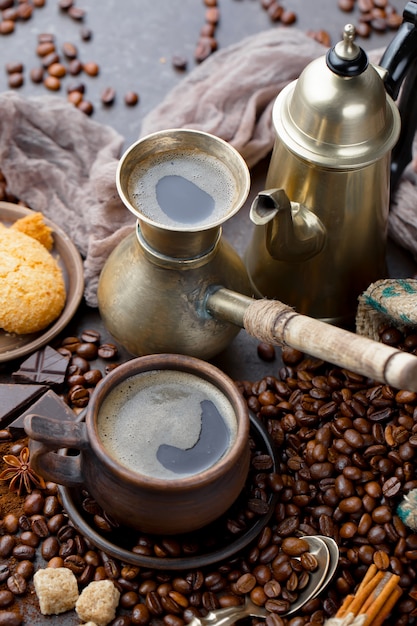 Coffee in a cup on coffee beans