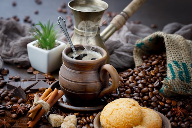 Coffee in a cup on coffee beans